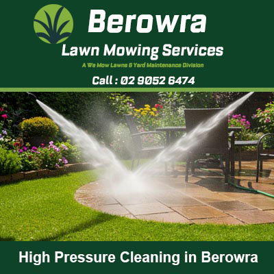 Dual pressure washers spraying water to clean in Berowra
