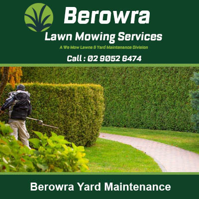 Worker using leaf blower to landscaped yard in Berowra